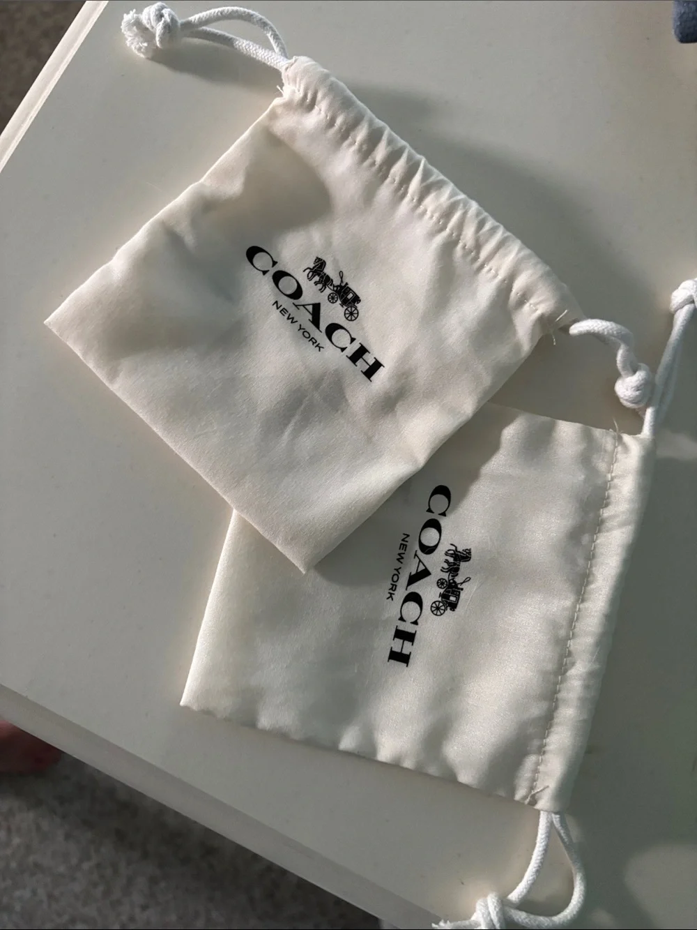 Coach Ivory Drawstring Pouches with Black Logo